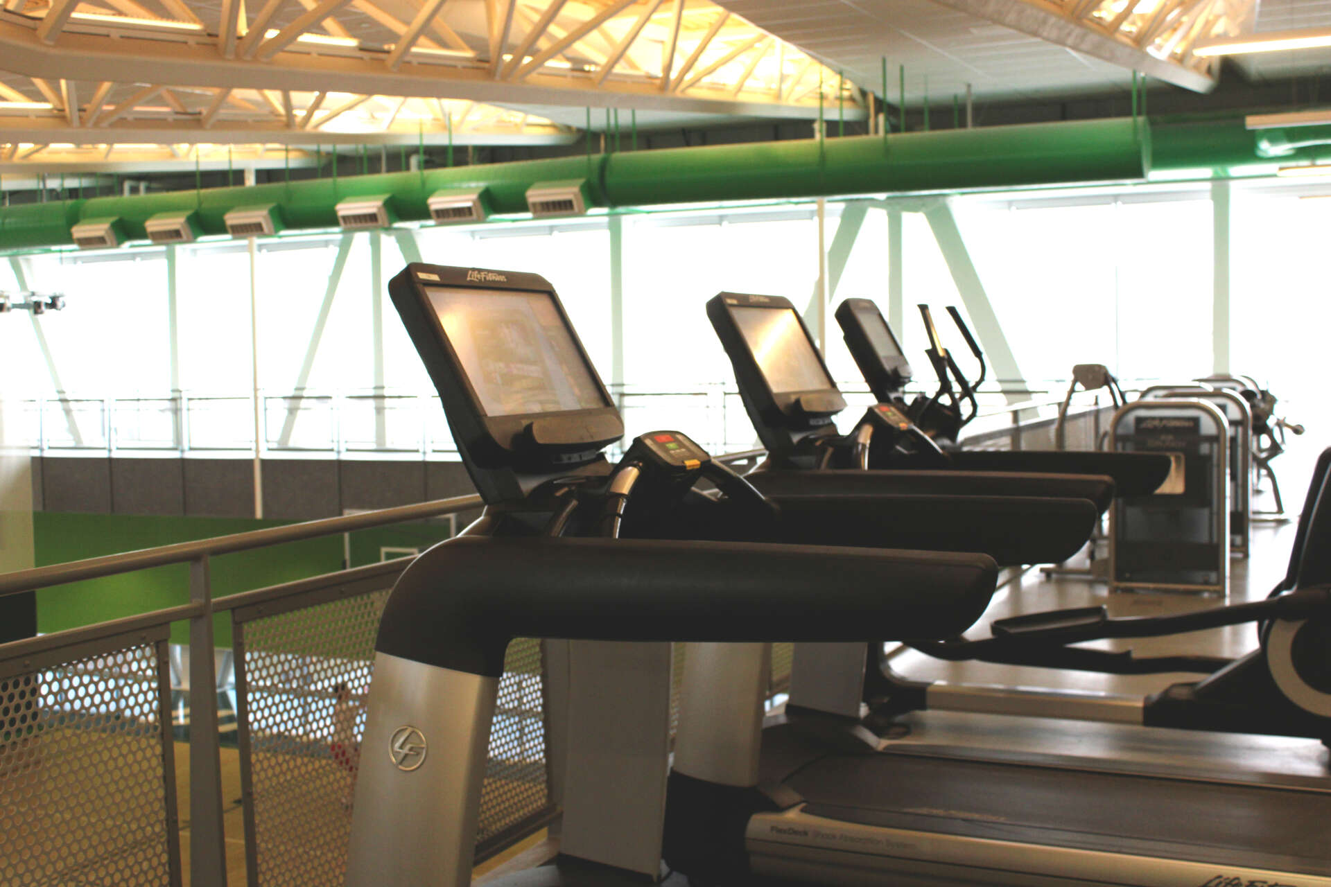 Cardio equipment lines a track at the Life and Wellness building.