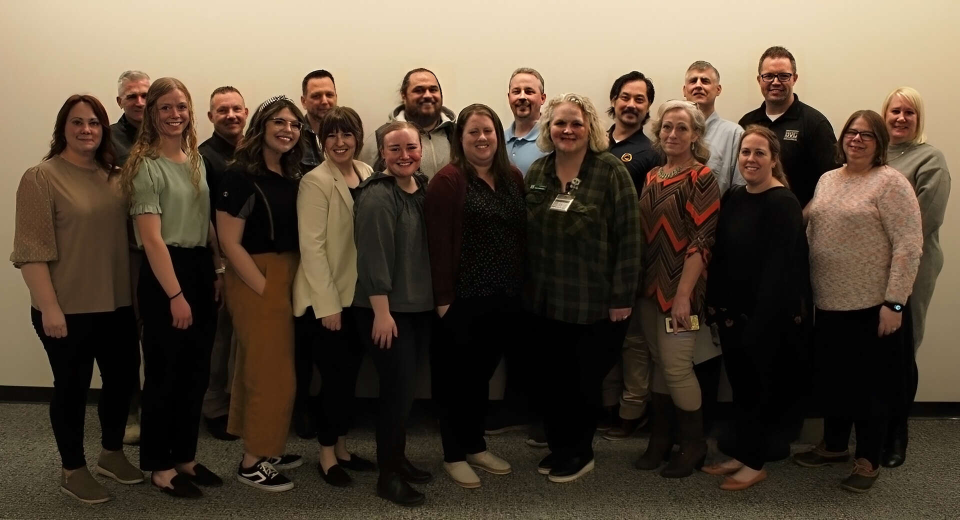 Professors, professionals, and advocates of the UVU Substance Use Prevention Coalition pose for the camera.