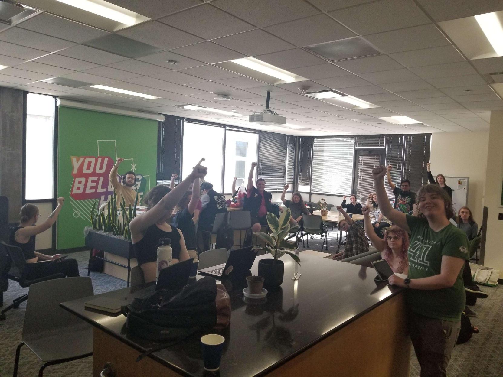 UVU students standing together in protest in the LGBTQ+ Lounge in WB 112